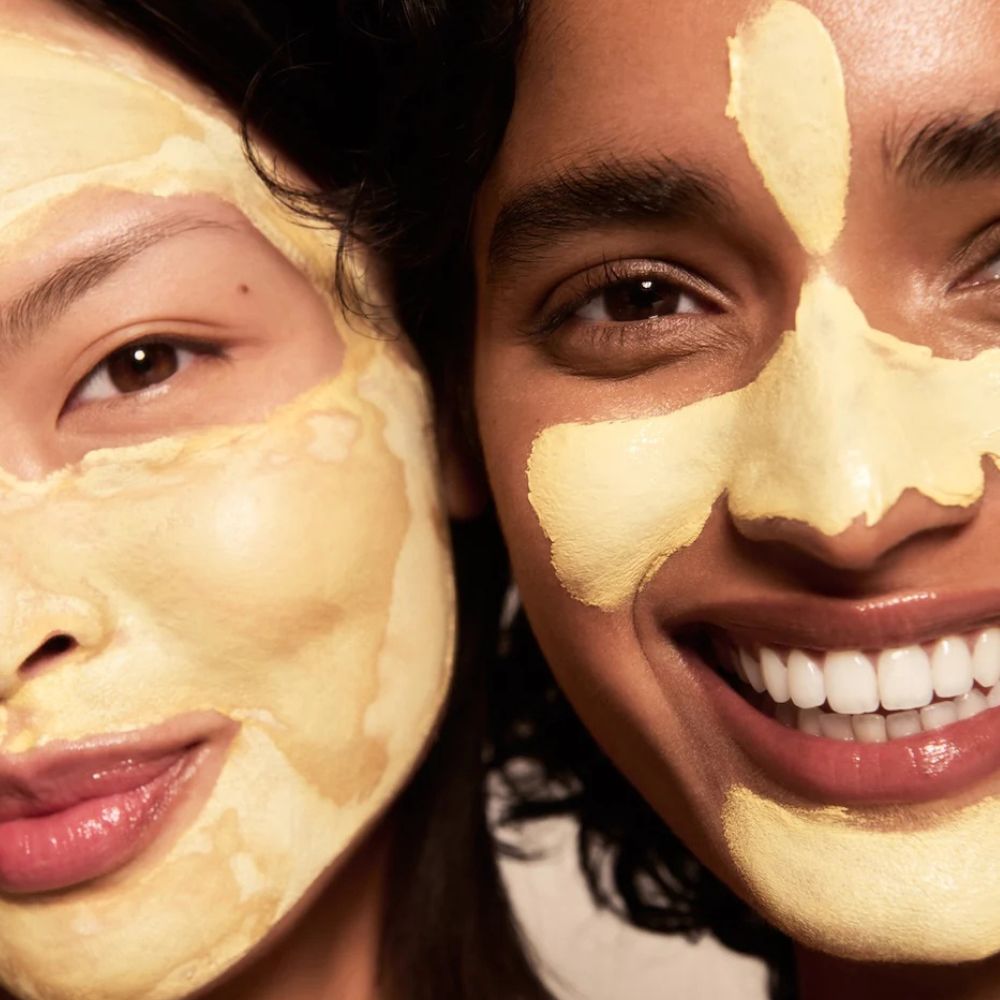 Two women with face masks on, close-up shot.