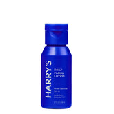 A blue bottle of Harry's Daily Facial Lotion SPF 15, featuring a matching blue flip-top cap, set against a plain white background.